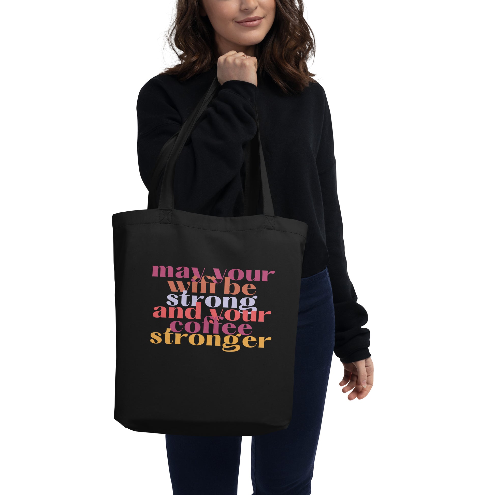 woman holding May Your Wifi Be Strong and Your Coffee Stronger Tote Bag