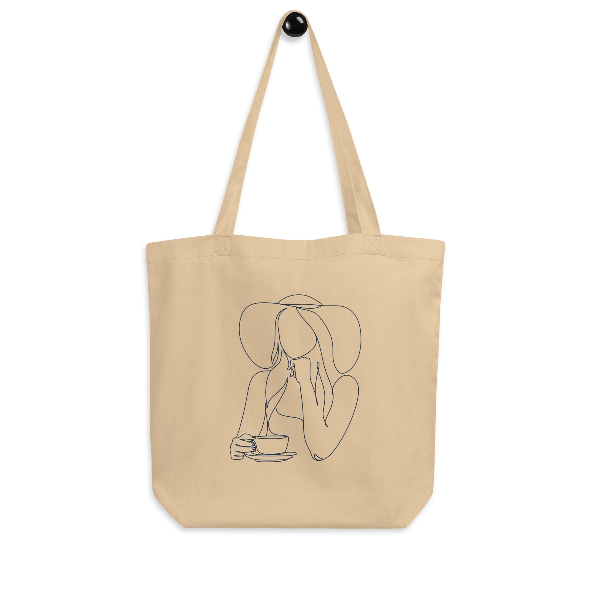 100% cotton tote bag feature artwork of woman wearing a hat drink hot coffee