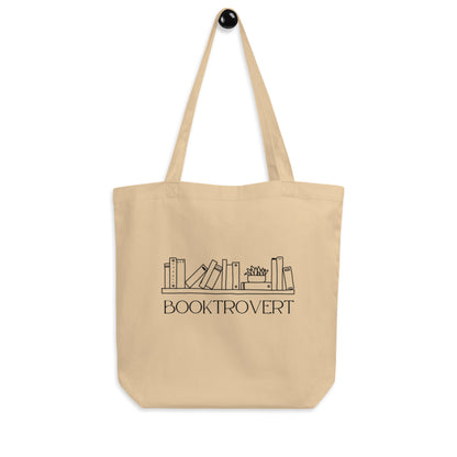 tan tote bag that says Booktrovert with cute bookshelf